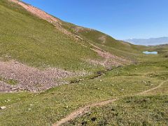 03A The trail gradually climbs the low shoulder of Pik Petrovski on day hike from Ak-Sai Travel Lenin Peak Base Camp 3600m